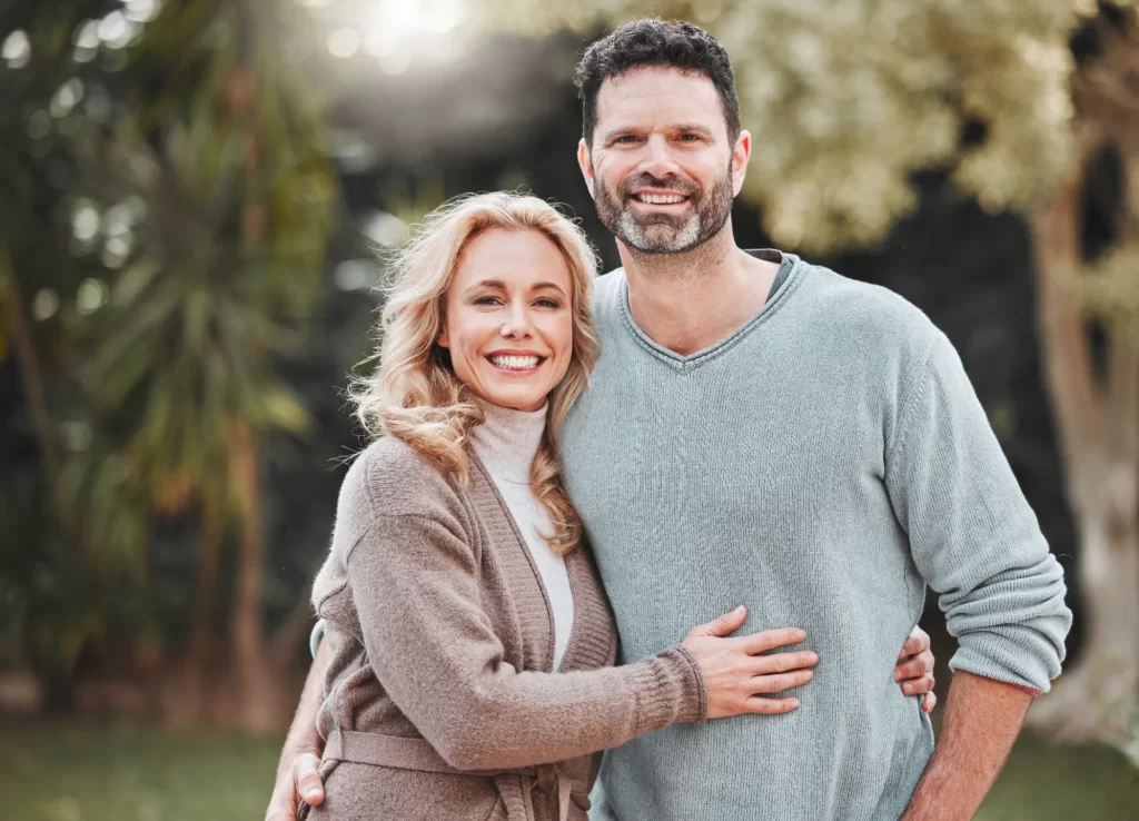 Happy couple embracing in a natural setting