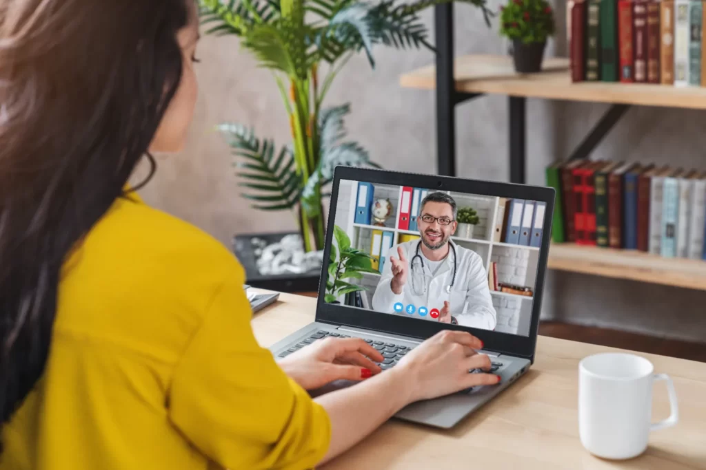 Woman on a video call with her doctor